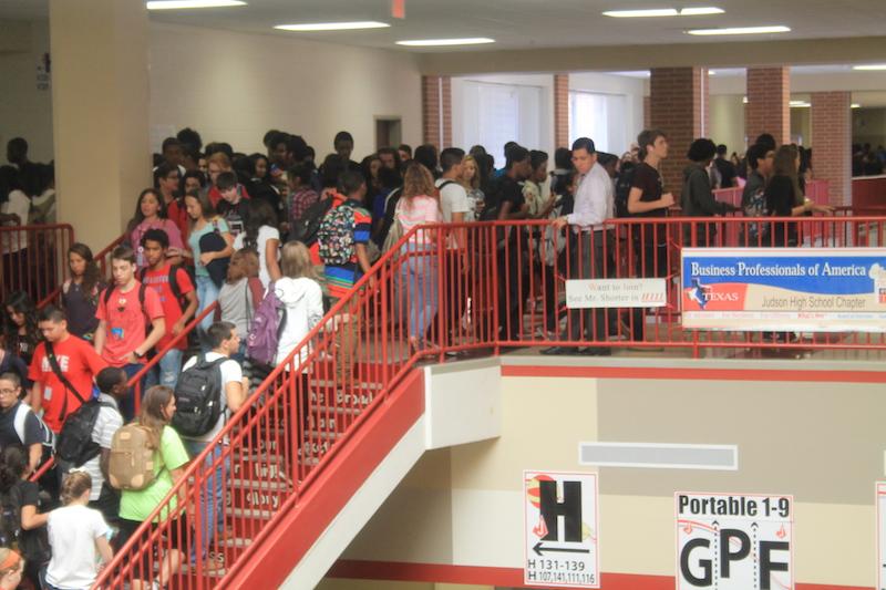Students are shown walking in the H-Wing. With over 3,600 students, Judson High School is the largest high school in San Antonio.