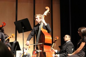 Jacob Bissel plays the cello in front of a packed audience. The orchestra, along with the band, played a holiday concert on December 16, 2014.