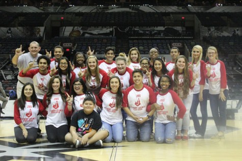 The Student Council, along with sponsor Ms. Samantha Matthis and Principal Jesus Hernandez, poses on the court of the AT&T Center. The group was invited to the game by the Spurs' Community Outreach Program.