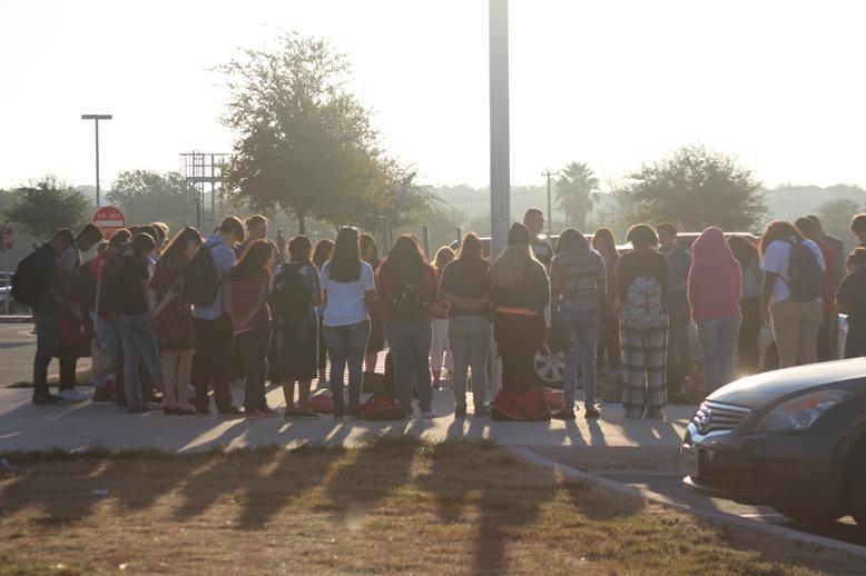 Students pray together at Pray at the Pole, a gathering of students to pray for a good school day.