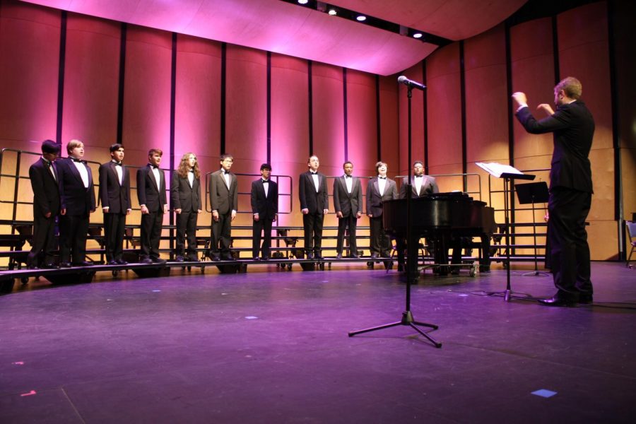 Mr. David Short conducts Brothers Ensemble during the choir concert. This is the last concert of the year for choir.