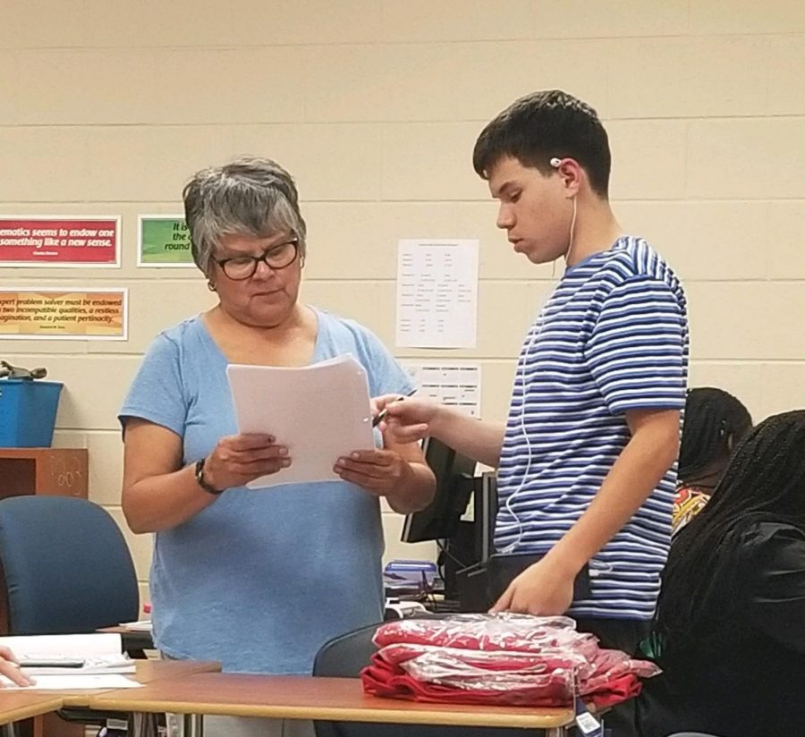 Ms. Bosquez listens to student, to help explain their classwork. Bosquez has been a teacher for 41 years and came back out of a one year retirement for the 2018-2019 school year.