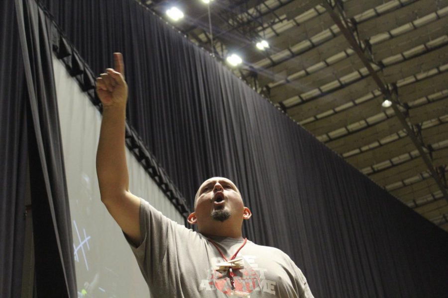 Principal Jesus Hernandez yells out at the Freeman Coliseum during the crowd. This year is Hernandezs eighth year as principal.