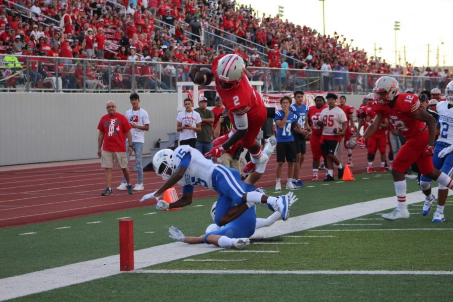 Mike Chandler dives into the end zone to score during the first quarter. The Rockets ended up winning the game, 46-28.