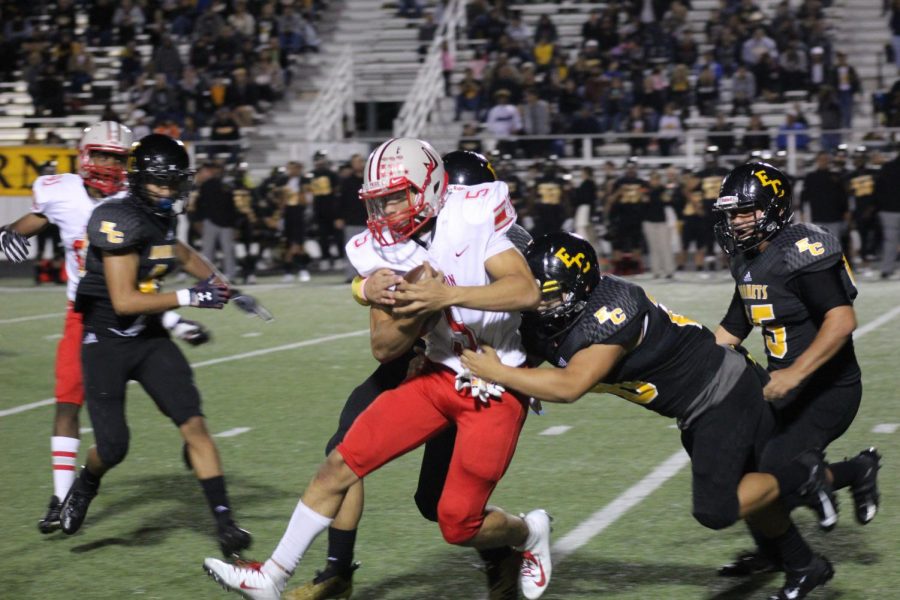 Sophomore Lucas Coley carries multiple East Central defenders to gain a first down. The Rockets beat East Central 51-14.