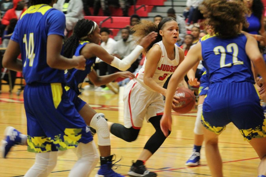 Senior Corina Carter drives past the Buffalo defense during a home district game. The Rockets blasted the Clemens Buffaloes, 85-41.