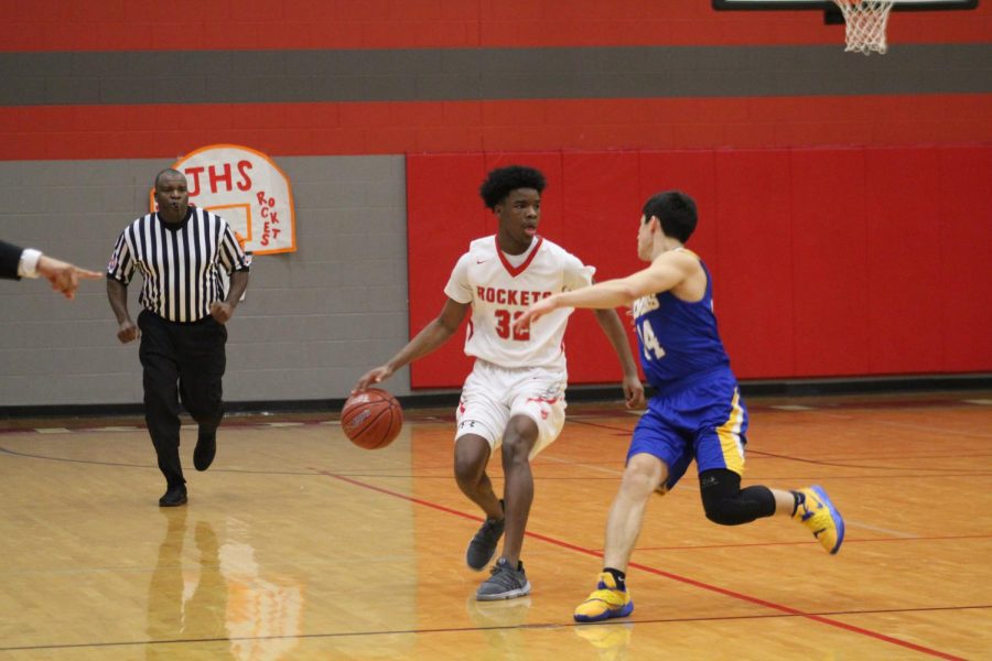 Senior Adrian Cohen brings the ball up to set up a play. The men lost to Clemens 73-80. 
