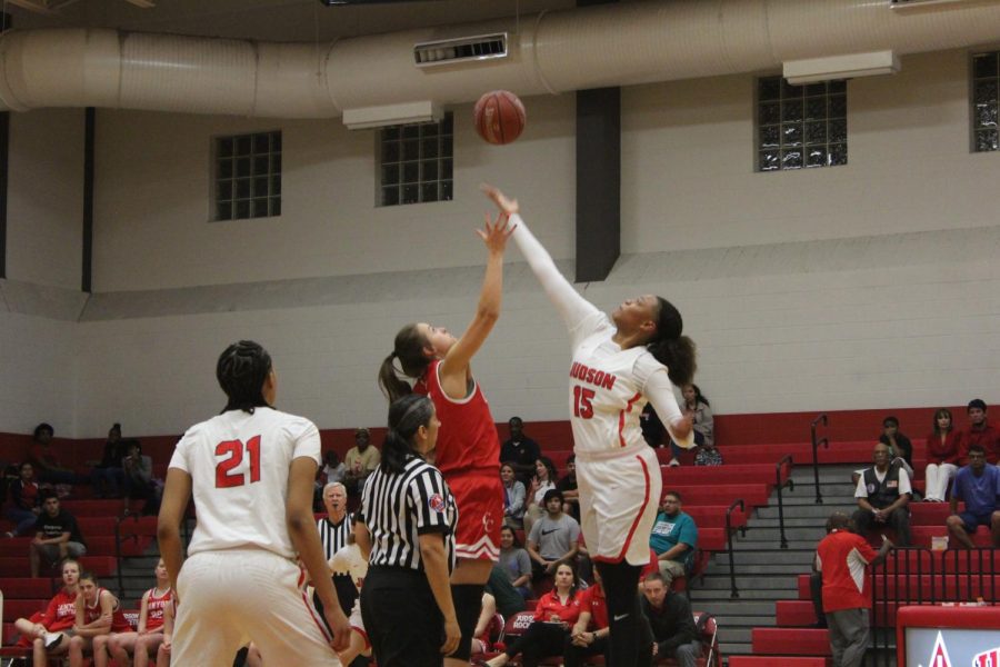 Center Elena Blanding battles for the tip off against the much smaller Canyon player. Photo by Alexandra Villanueva.
The senior basketball players receive congratulations and gifts at the annual senior game, taking in the moment with family and friends. Lady Rockets went on to win by a convincing 62-27.