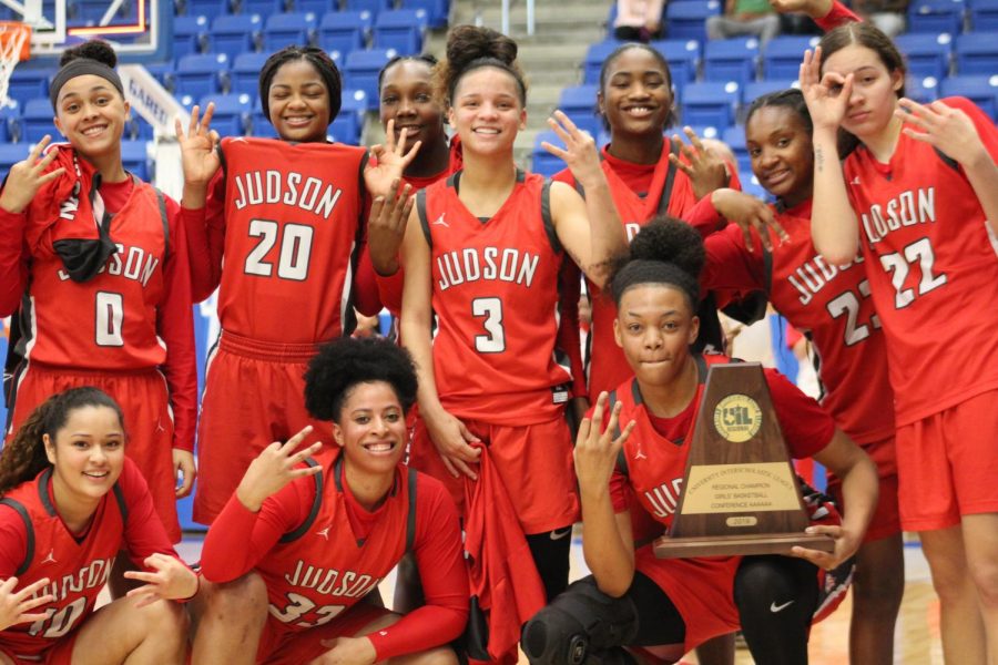 The Lady Rockets basketball team poses for the camera for their championship photo at Northside Sports Gym. The Lady Rockets beat Clark, 71-44, to advance to the State Tournament for the third consecutive season.