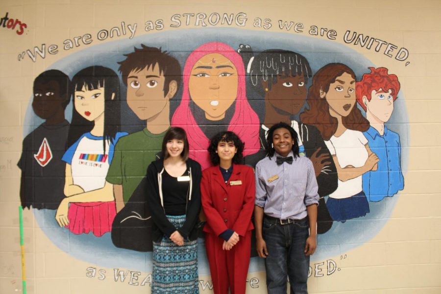 The animation team stands in front to their proud masterpiece which represents unity. The mural is painted on the side of the F wing upstairs.