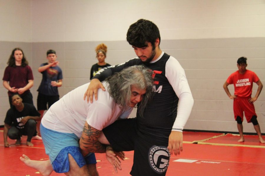 Mr. Victor Santos teachers a student how to grapple. This is the first year for the ju-jitsu club on campus.