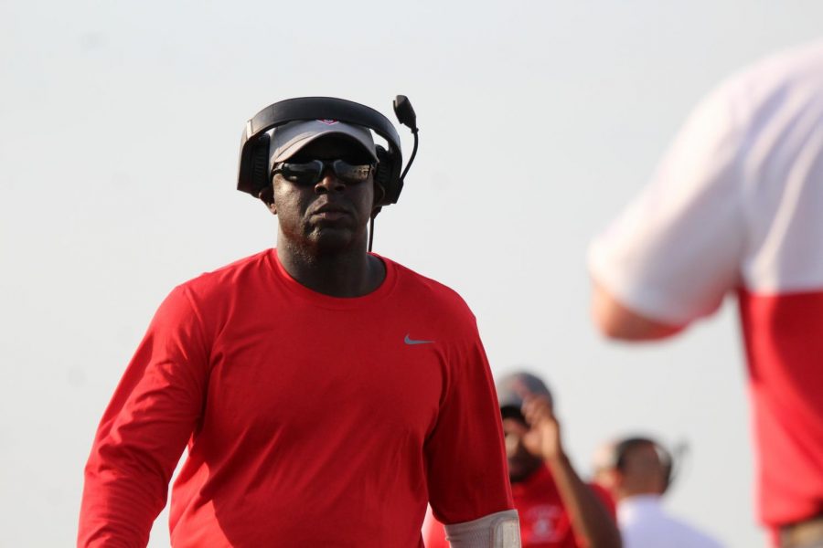 Coach Rodney Williams walks on the sidelines during the first regular season game against the Clear Springs Chargers. This is his first year has head coach.