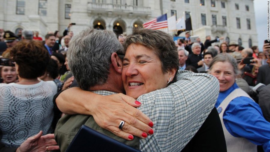Image+%23%3A+22200211++++Senator+Donna+Nesselbush+%28R%29+embraces+a+supporter+after+the+Marriage+Equality+Act+was+signed+into+law+at+the+State+House+in+Providence%2C+Rhode+Island%2C+May+2%2C+2013.+Rhode+Island+became+the+10th+U.S.+state+to+extend+marriage+rights+to+same-sex+couples.+REUTERS%2FJessica+Rinaldi+%28UNITED+STATES+-+Tags%3A+POLITICS+SOCIETY%29+++++++REUTERS+%2FJESSICA+RINALDI+%2FLANDOV