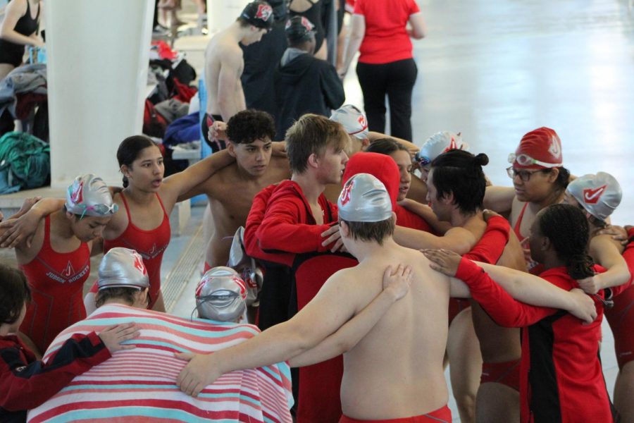 The swim team does their team chant after a meet at the Northside Natatorium. In the spring, Coach Murphy is looking to start up a water polo team.