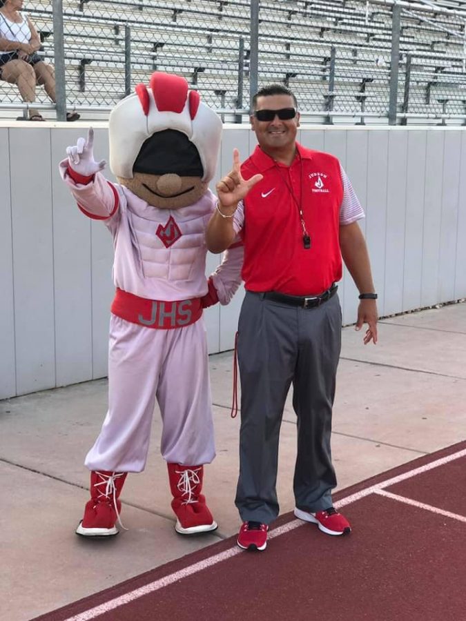 Coach+John+Torres+takes+a+picture+with+Rocket+Man+during+a+game+at+Rutledge+Stadium.+Torres+retired+from+Judson+ISD+and+education+in+2019.