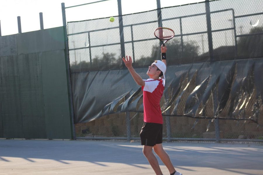 Junior Diego Cortes serves the ball during a match against East Central. The Rockets fell to the Hornets 10-4.