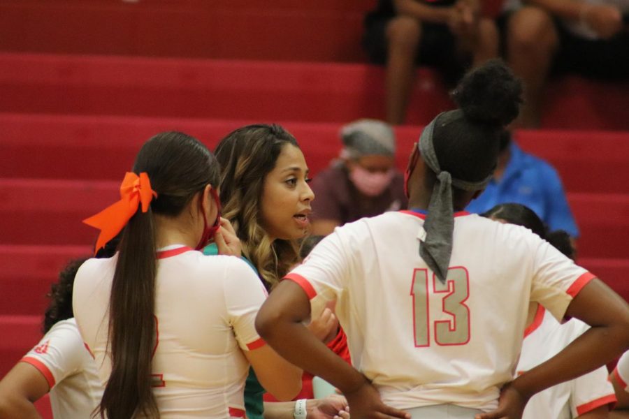Coach Kimberly De Los Santos coaches her girls during the game against Clemens. The girls fell to Clemens, 0-3.