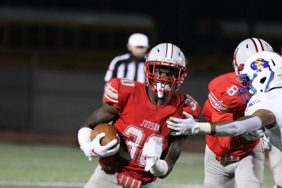 Senior DeAnthony Lewis breaks free from a defender to gain a first down and more. The Rockets beat Clemens, 34-28.