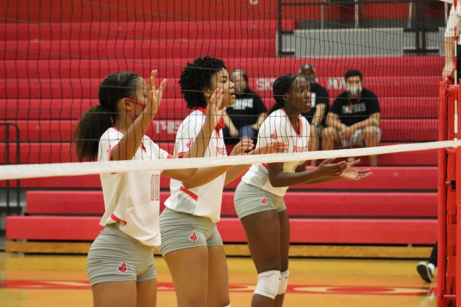 Juniors Cirila Pettit, Alania Afalava, and Alexis Walker set up and wait to block the ball from Steele. The Lady Rockets fell to the Knights, 0-3.