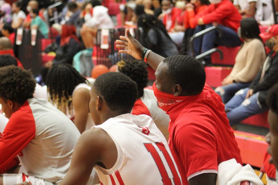 Coach Shawn Bedford coaches XXXX during the game against Wagner.