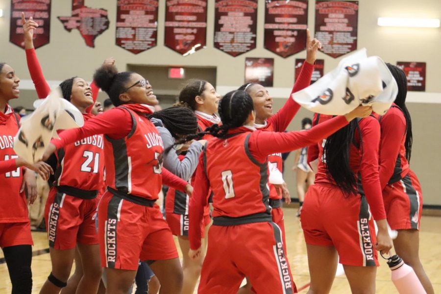 The girls basketball celebrates their first win of the playoffs after they beat Johnson. At press time, the next round opponent has yet to be determined.