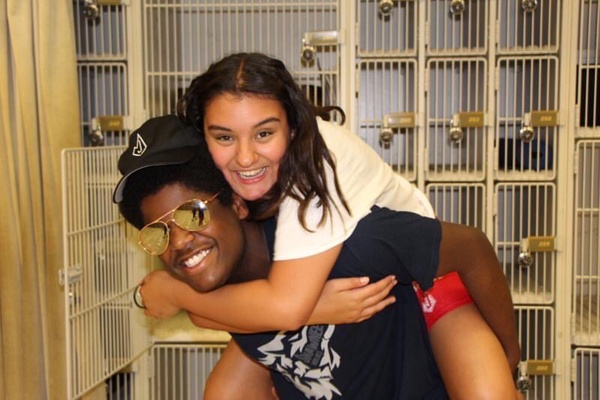 Junior Jon James and Christina Moriel, graduate of 2020, hang out in the band hall after a marchathon.