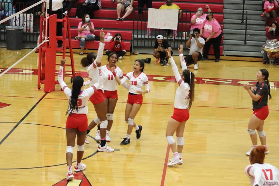 The Lady Rockets celebrate their win against Wagner in the annual Dig Pink game.