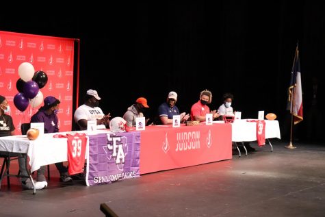 Cameron Scott, DeAnthony Lewis, and Robert Rigsby sign their letters of intent during last years National Signing Day. All three, including other Rockets, have been successful at UTSA this year.