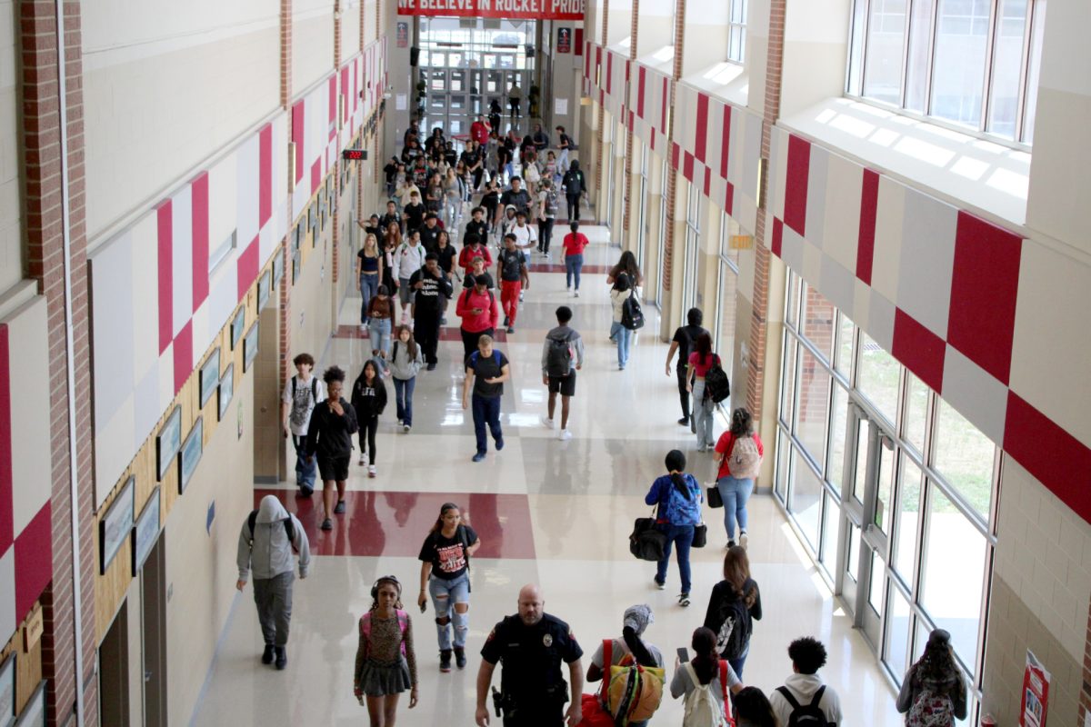 Students rushed through the main hallway for the sixth time today.