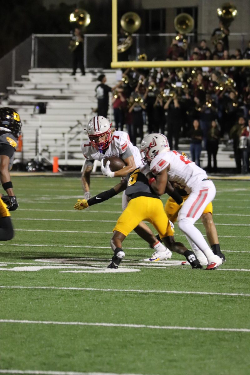 Senior wide receiver Kenyon Smith attempts to outrun the East Central defensive line during the second quarter.