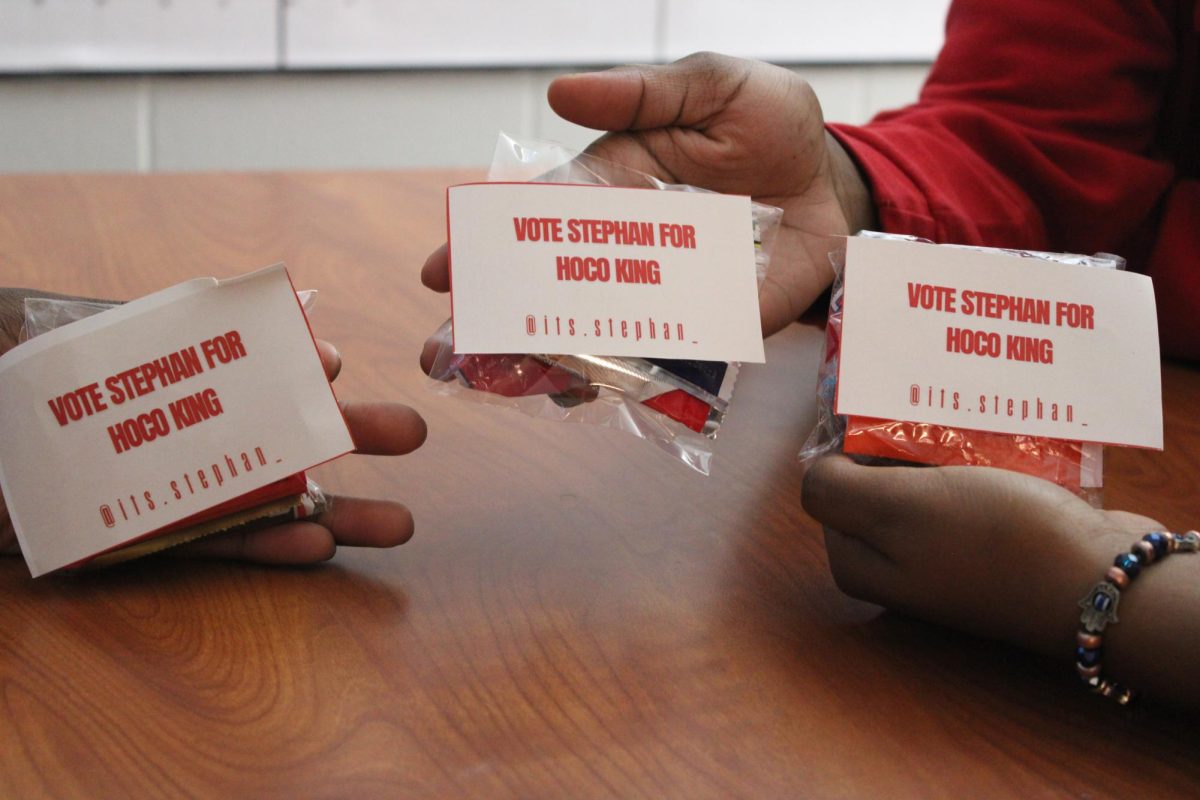 Students enjoy campaign treats passed out by the homecoming court.