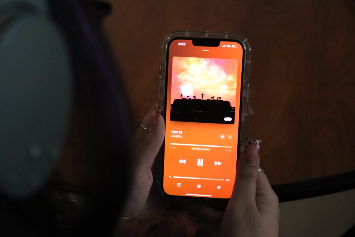 Student listens to newest TikTok hit, “TGIF” by GloRilla.