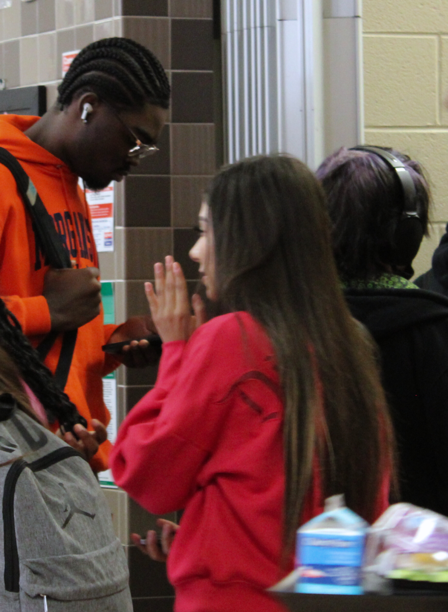 Students enjoy listening to music as they patiently wait in line during B lunch.