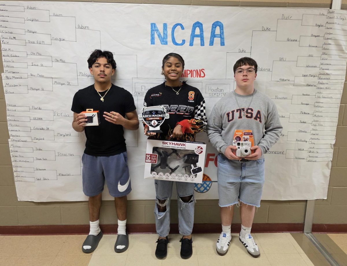 March Madness bracket competition winners celebrate their win and take home their prizes.