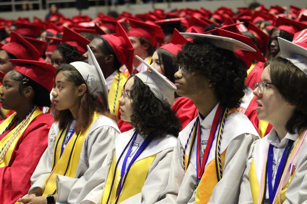  The top 10 ranked students of the Judson High School class of 2025 sit front row during the graduation ceremony. The top 10 students wore gray gowns to recognize their academic achievements while the rest of the students wore red gowns.